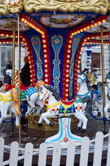 Fototapeta na wymiar children's fun colorful carousel with horses