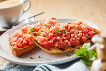 Spicy salsa topping and coriander on tostada
