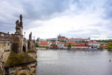 Obraz premium Old Town ancient architecture and river pier in Prague, Czech Republic