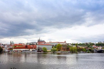 Obraz premium Old Town ancient architecture and river pier in Prague, Czech Republic