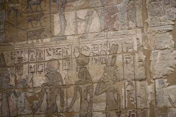 Fototapeta na wymiar Symbols signs figures of the Pharaohs in Egypt, the wall in Luxor