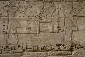 Symbols signs figures of the Pharaohs in Egypt, the wall in Luxor