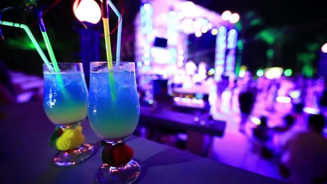 colourfull night club background with coktail glass