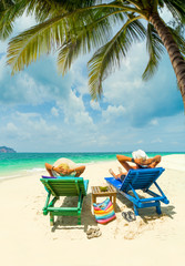 Fototapeta na wymiar Couple on the beach at tropical resort Travel