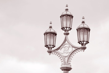 Fototapeta na wymiar Lamppost on Westminster Bridge, London in Black and White Sepia Tone