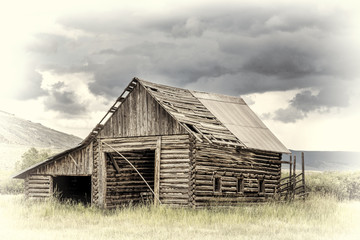 old rustic log barn in Rocky Mountains