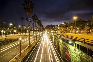 Fototapeta na wymiar Night traffic at Ronda Litoral Avenue in the coastline of Barcelona