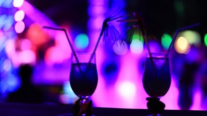 colourfull night club background with coktail glass