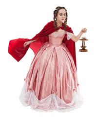 Beautiful woman in old historic medieval dress with lantern