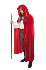 Medieval man in cape with cane isolated