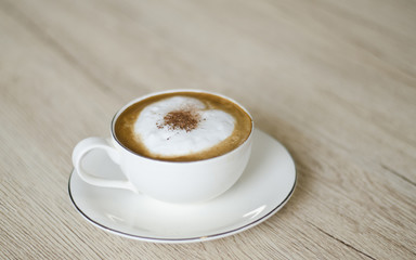  Coffee cup with hearts on old table