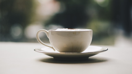  Coffee cup with hearts on old table