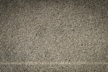 pressed gray background with small stones