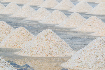 Salt is produced by evaporation sea water called Naklua Mass farm in Petchaburi province of Thailand