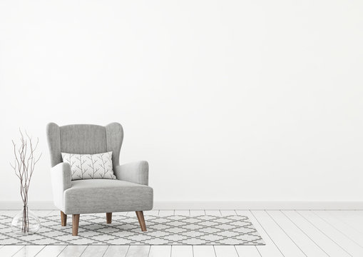 Simple and cozy livingroom interior with grey armchair, pillow, twigs in vase and scandinavian style rug on clear white wall background. 3D rendering.