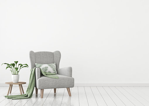 Simple urban jungle style interior with grey armchair, green plaid, tropical pattern pillow and plant on white wall background. 3D rendering.