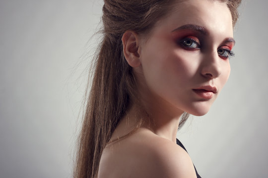 Young woman in bright makeup