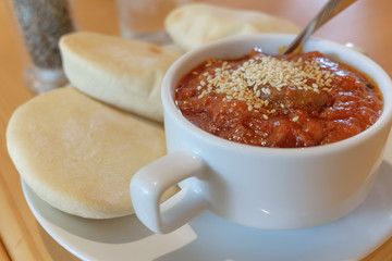 Beef in apple wine sauce with pita bread