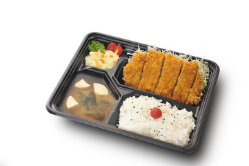 Isolated and clipping path of tonkatsu set in bento box set. (Tonkatsu : Deep Fried Pork Tenderloin)
