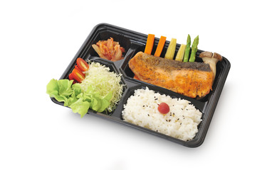 Isolated and clipping path of salmon steak set in bento box set.
