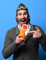 Fototapeta premium bearded pilot with cocktail in glass