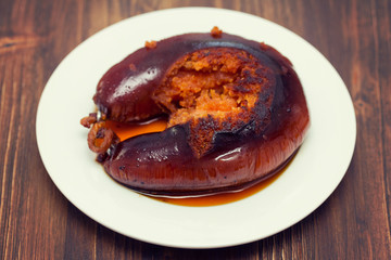 grilled poartuguese sausage farinheira on white plate