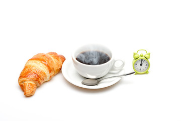 Fresh croissant and cup of coffee isolated on white background