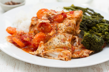 rabbit with carrot, rice and greens on white plate