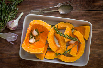 Chopped pumpkin in the baking tray.