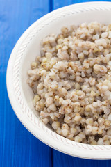 boiled green buckwheat in white bowl