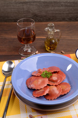 red radicchio ravioli with mushroom cream