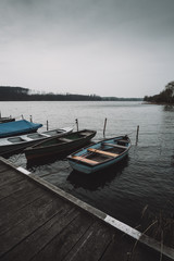 Naklejka na ściany i meble Boats on the lake pier