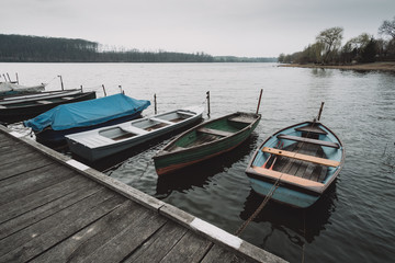 Fototapeta na wymiar Boats on the lake pier
