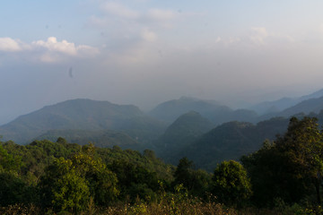 Mountain layer background in evening white cloud