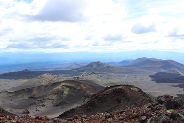 Black and red ash, valley of hills, after volcanic eruption