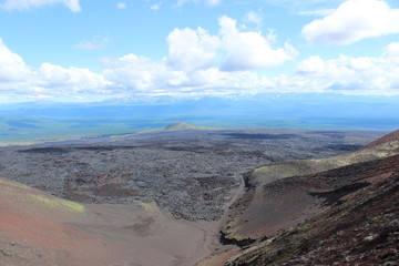 Black and red ash, valley of hills, after volcanic eruption