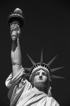 Fototapeta Statue of Liberty front view, black and white with black sky in New York
