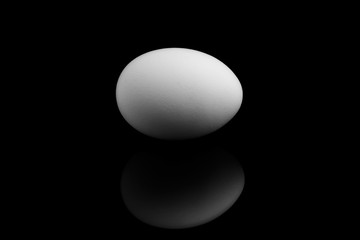 Egg white on a black background in the middle