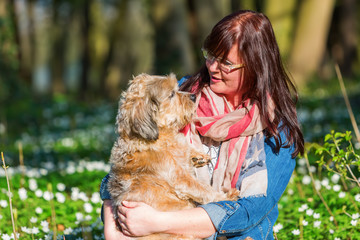 young woman and her dog between thimbleweeds