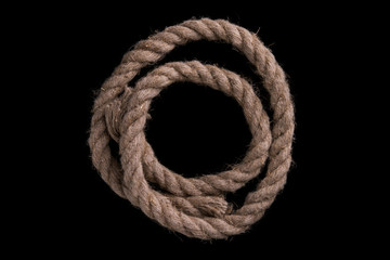 Thick rope on a black background. Sea rope