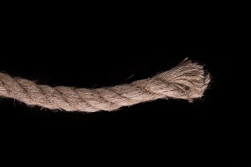 Thick rope on a black background. Sea rope