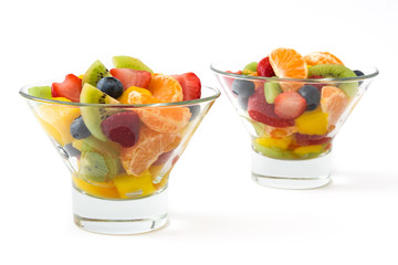 Fruit salad in crystal bowl isolated on white background.Closeup
