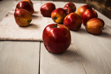 red apples on wooden background