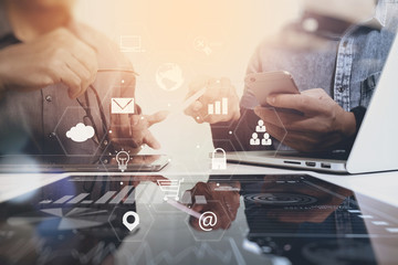 co working team meeting concept,businessman using smart phone and laptop and digital tablet computer in modern office with virtual interface icons network diagram