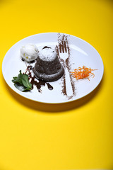cupcake or cake with jam, ice cream, berry on yellow