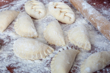 Fototapeta na wymiar Vareniki - dumplings with cottage and cheese