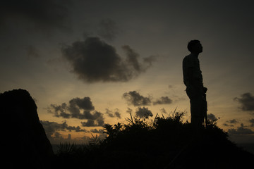 Asian man on top of mountainin Co To island