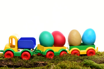 painted easter colorful eggs in plastic car toy