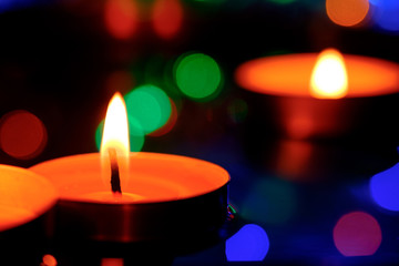 Candle light in the water in the pool on the twilight.