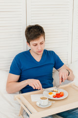 Man having Breakfast in bed
